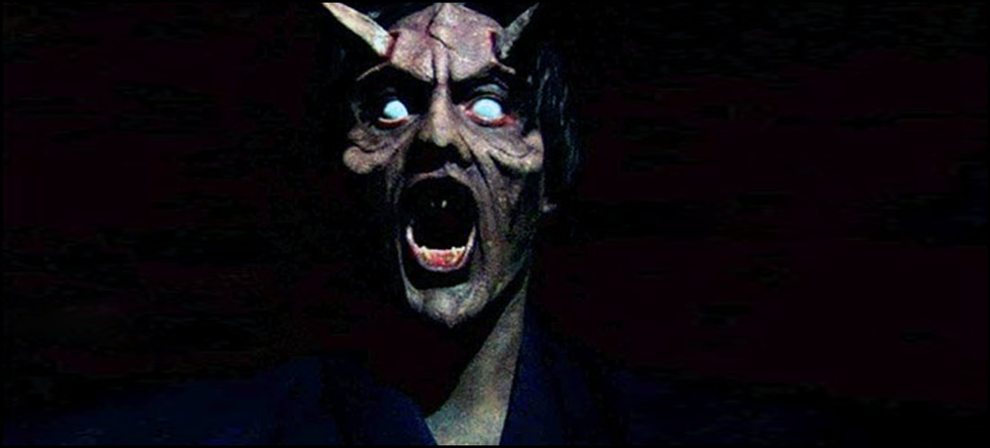 Nightmare Demon: a horned, white-eyed demon screaming out of the darkness